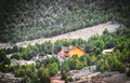 Beautiful luxury log cabin with wide deck on hill in Utah between Bryce and Zion - Pine tree covered hills Royalty Free Stock Photo