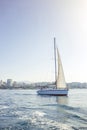 Yacht with white sails on the calm sea in good sunny day.