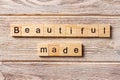 Beautiful made word written on wood block. Beautiful made text on table, concept