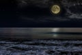 Beautiful magic blue night sky with clouds and full moon stars reflexion in water Royalty Free Stock Photo