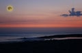 Beautiful magic pink and blue night sky with clouds and full moon and stars near sea Royalty Free Stock Photo