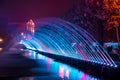 Beautiful magical landscape with colorful fountain jets on the w