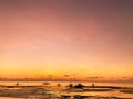 Beautiful, magical red sunset, sunrise in the tropics.Calm sea with dark silhouettes of boats. Low tide on beach Royalty Free Stock Photo