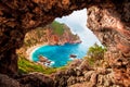 Beautiful magical view of the Gyali beach in Corfu, Greece through a hole in the rock. amazing places. popular tourist atraction Royalty Free Stock Photo