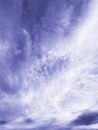 Beautiful magnificent majestic cirrus clouds in daytime sky in color of 2022 year Very Peri.
