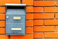 A beautiful mailbox hangs waiting for newspapers, parcels and letters