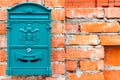 A beautiful mailbox hangs waiting for newspapers, parcels and letters