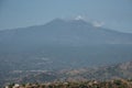 Beautiful view of majestic volcanic Mount Etna with townscape in foreground Royalty Free Stock Photo