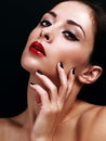 Beautiful makeup woman with bright red lips and black manicured Royalty Free Stock Photo