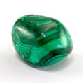 Beautiful malachite gemstone with nice texture, isolated on white background. Rounded smooth surface.