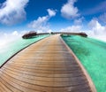 Beautiful maldives beach and water villa with fish-eye lens Royalty Free Stock Photo