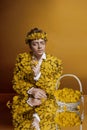 Beautiful man with dandelion coat portrait background beauty portrait photoshoot Royalty Free Stock Photo