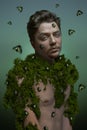 Beautiful man with green bettles on his face portrait background beauty portrait photoshoot Royalty Free Stock Photo