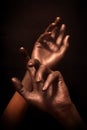 Beautiful man's hands in bronze paint