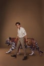 Beautiful man with tiger in studio background beauty portrait photoshoot