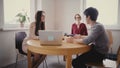 Beautiful manager woman walks into job interview office. Young Asian man applying for a new position talks to HR 4K. Royalty Free Stock Photo