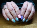 The manicurist excellently made her work a beautiful manicure with a polish gel on her hands and the client is happy