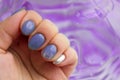 Beautiful manicure. rounded violet nails on a female hand. close macro photo