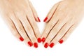 Beautiful manicured woman's hands with red nail polish