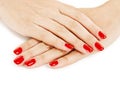 Beautiful manicured woman's hands with red nail polish