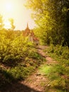 Beautiful mansion in the old style in the Sunny forest. Castle on green meadows in the sun