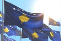 Beautiful many Kosovo flags are waving on blue sky background - any holiday flag 3d illustration