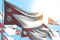 Beautiful many Nepal flags are waving against blue sky picture with soft focus - any holiday flag 3d illustration