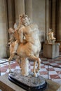 Beautiful marble sculptures on elaborate stands in one of many rooms inside The Louvre,Paris,France,2016