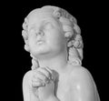 Beautiful marble statue of an pray infant angel isolated on black Royalty Free Stock Photo