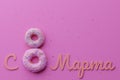 Beautiful 8 march greeting card with donuts in form of eight with pink icing and colorful sprinkles and 8 March international wome