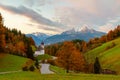 Beautiful Maria Gern church against the backdrop of the famous Watzmann Mountains in beautiful autumn colors near the charming