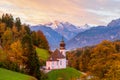 Beautiful Maria Gern church against the backdrop of the famous Watzmann Mountains in beautiful autumn colors near the charming