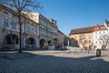 Beautiful market square in Bielsko-Biala. Low tenement houses with arcades. Clear sky. Surface made of granite cubes Royalty Free Stock Photo