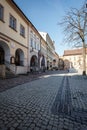 Beautiful market square in Bielsko-Biala. Low tenement houses with arcades. Clear sky. Surface made of granite cubes Royalty Free Stock Photo