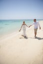 Beautiful married couple on a tropical beach wedding day Royalty Free Stock Photo