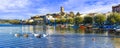 Beautiful Marta village,view with Bolsena lake,boats and old cathedral,Lazio,Italy.