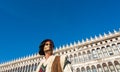 Beautiful mask at St. Mark square during the carnival of Venice