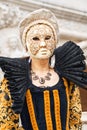 Beautiful mask at St. Mark square during the carnival of Venice