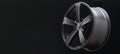 Beautiful matte alloy wheels close -up on a dark background. Black and white drawing, auto tuning. copyspace long layout for Royalty Free Stock Photo