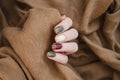 Beautiful matte muted color nails close-up, glittery nail art manicure