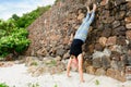 Beautiful mature aged woman doing yoga on a desert tropical beach Royalty Free Stock Photo