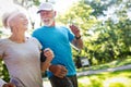 Beautiful mature couple jogging in nature living healthy Royalty Free Stock Photo