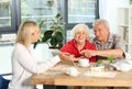 Beautiful mature couple with real estate agent in office Royalty Free Stock Photo