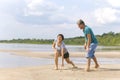 Beautiful mature sportive couple doing gymnastic exercises on the beach Royalty Free Stock Photo