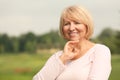 Beautiful mature woman outdoors on summer day Royalty Free Stock Photo