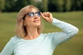 Beautiful mature woman outdoors on summer day Royalty Free Stock Photo