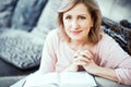 Beautiful mature woman is reading a book Royalty Free Stock Photo