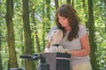 Beautiful  woman riding a bike with her dog Royalty Free Stock Photo