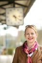 Beautiful mature woman smiling under train station Royalty Free Stock Photo