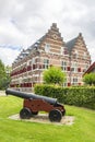 The beautiful Mauritshuis museum with an old gun in the foreground, in the historic fortress town Willemstad, Netherlands